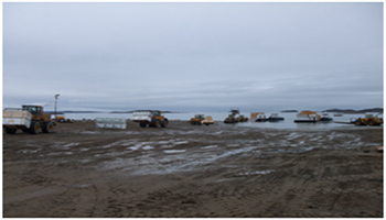 Unloading Barges on Iqaluit Shoreline